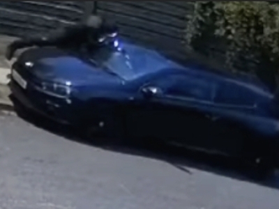 Two men caught on camera checking cars in Brooklands
